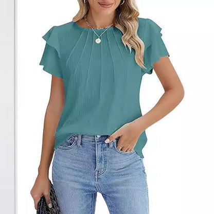 Phelia – Black top with playful flounce sleeves