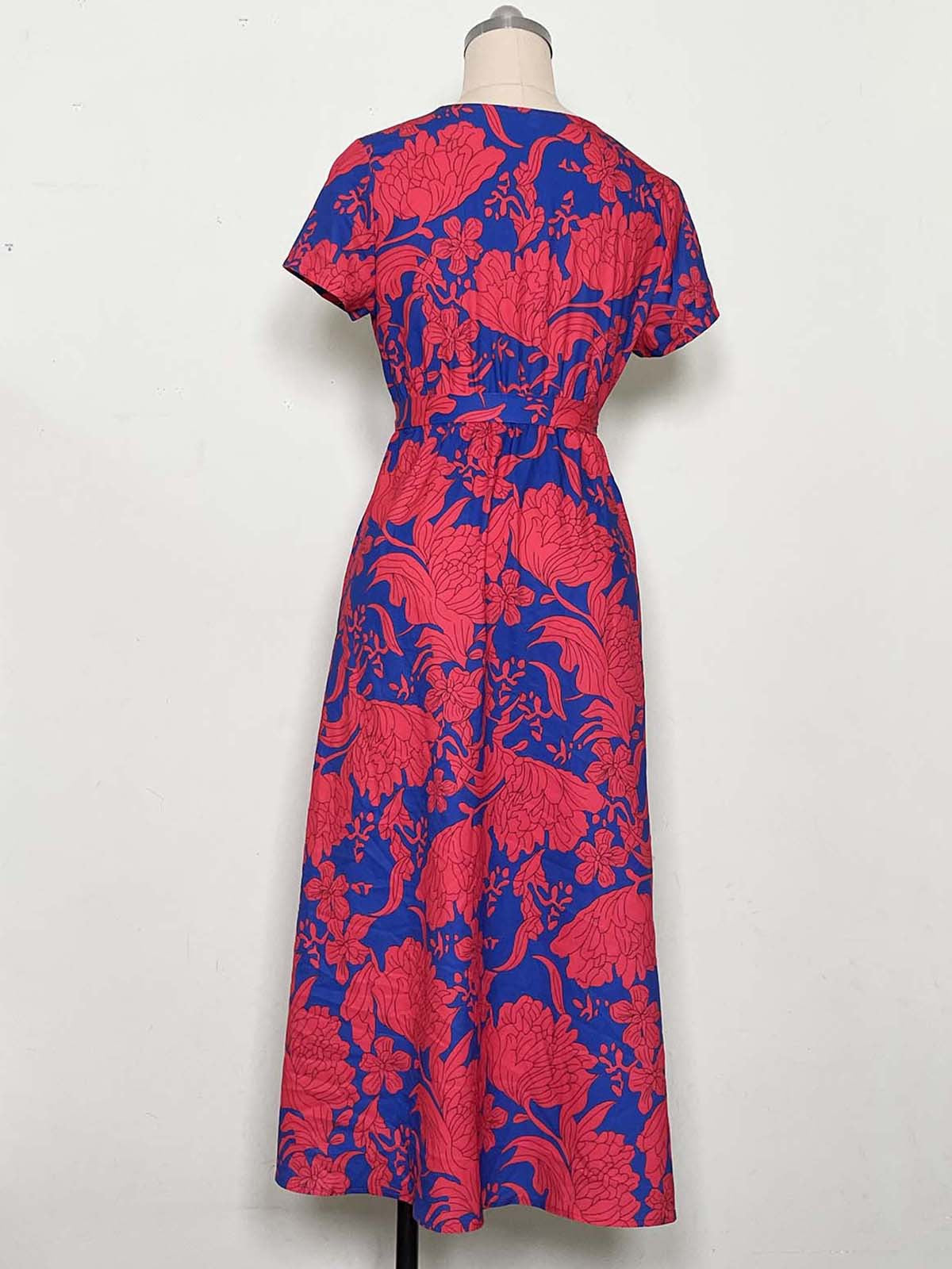 Nerina – midi klänning med omlott och prickar